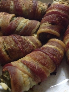 A picture of Jalapenos wrapped in bacon.