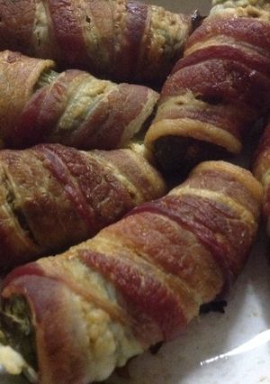 A picture of Jalapenos wrapped in bacon.