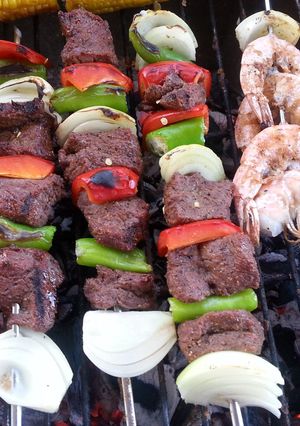 A picture of Cube steak and shrimp barbecue kebab.