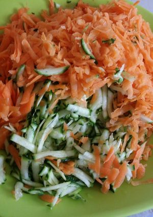 A picture of Buttered carrots and zucchini.