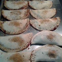 A picture of sweet and tart chocolate cherry empanadas.