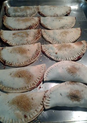 A picture of sweet and tart chocolate cherry empanadas.