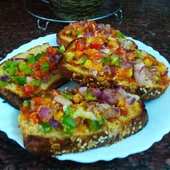 Homemade multigrain bread sooji pizza A picture of Homemade multigrain bread sooji pizza.