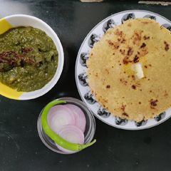 A picture of Sarson ka Saag with Makki ki Roti.