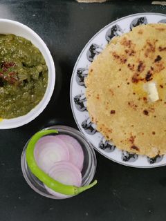 A picture of Sarson ka Saag with Makki ki Roti.