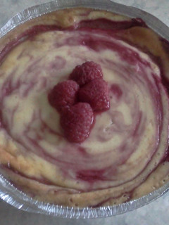 A picture of Raspberry and white chocolate cheesecake.