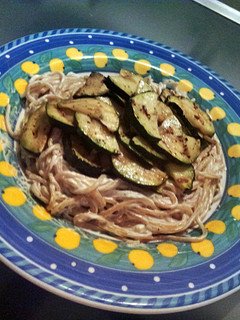 A picture of Cream cheese garlic spaghetti with grilled zucchini.