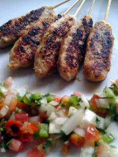 A picture of fish satai with salsa sauce.