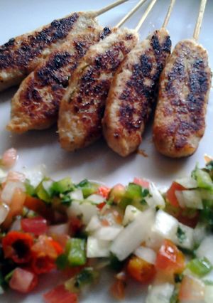 A picture of fish satai with salsa sauce.