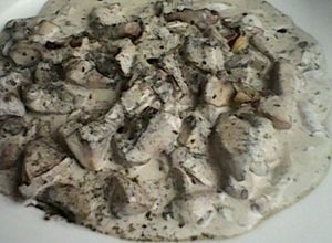 Una foto de Portobellos en crema espesa