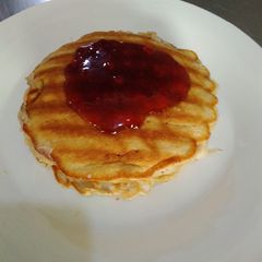 A picture of Pancake and crepes and syrup.