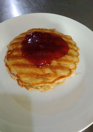 A picture of Pancake and crepes and syrup.