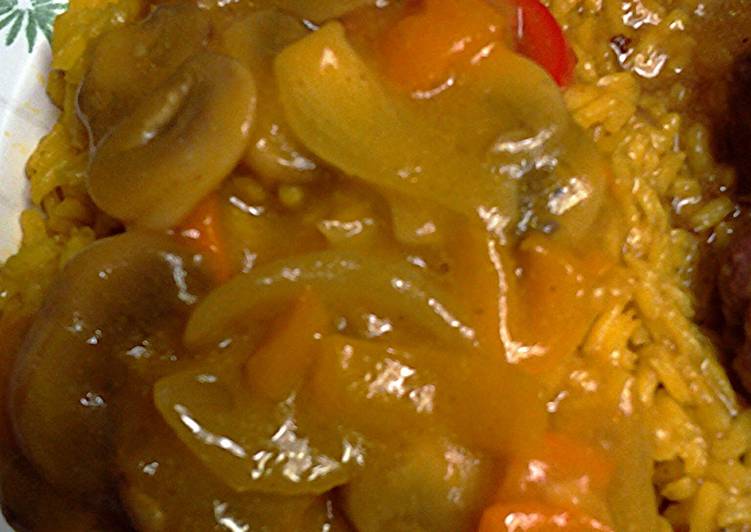 curry mushrooms and peppers in a sauce