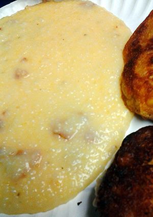 A picture of Grits bacon and cheese.