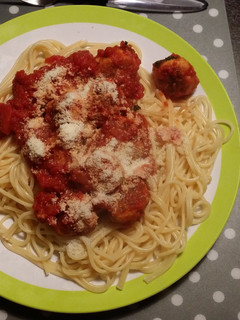 A picture of Spaghetti with fish meat balls.