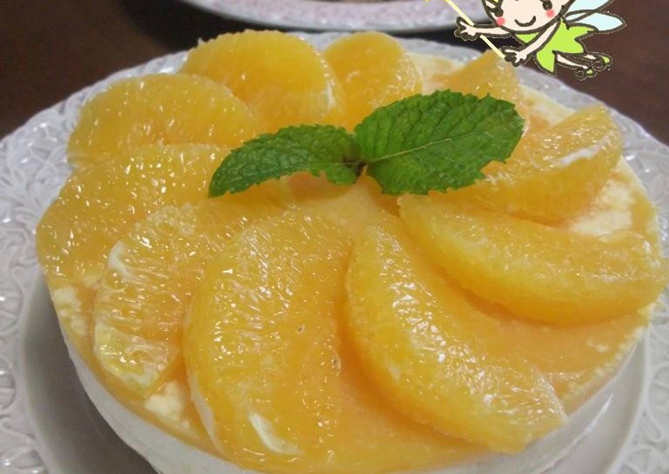 Fresh cheesecake with fresh orange slices