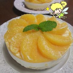 A picture of Refreshing Cheesecake with Fresh Orange Slices.