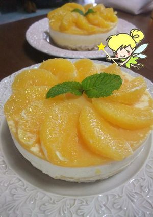 A picture of Refreshing Cheesecake with Fresh Orange Slices.