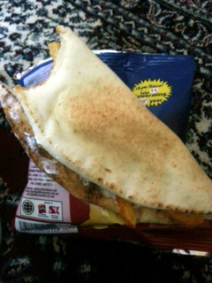 A picture of Arabian bread with cheese.