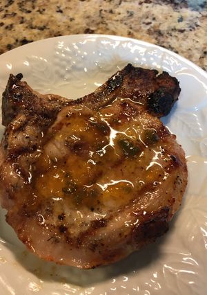 A picture of Grilled Pork Chop with a Peach Preserves Jalapeño Glaze.