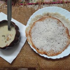 A picture of Kerala style Vegetable stew and Appam.
