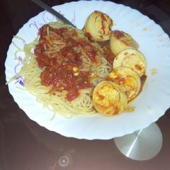 Egg curry with spaghetti A picture of Egg curry with spaghetti.