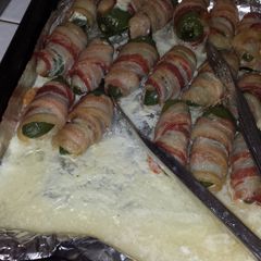 A picture of Bacon wrapped chicken stuffed jalapenos.
