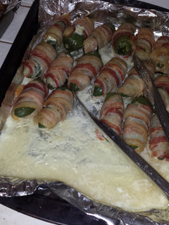 A picture of Bacon wrapped chicken stuffed jalapenos.