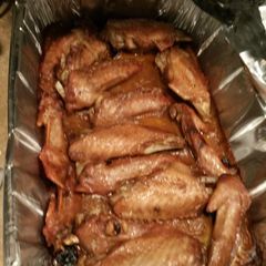A picture of Deep fried Turkey wings smothered an covered in roasted garlic gravey..