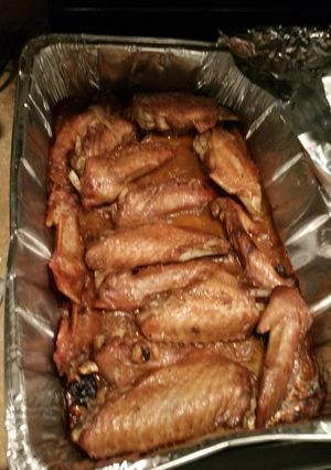 A picture of Deep fried Turkey wings smothered an covered in roasted garlic gravey..