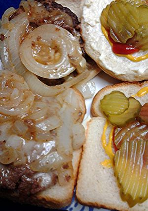 A picture of Brie burgers and onions.