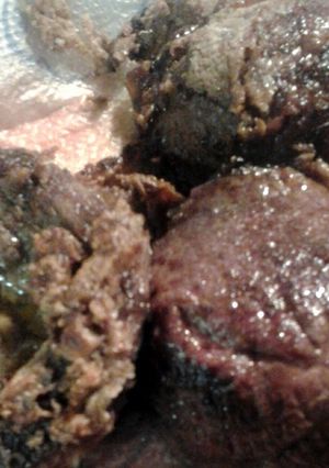 A picture of beef in a pan.