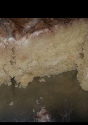 A picture of Vanilla sponge cake with white chocolate ganache.