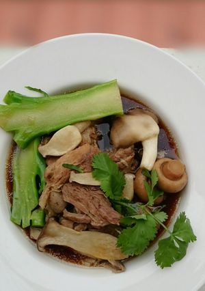 A picture of Herbal Pork Soup / Bak Kut Teh With Mix Mushroom And Brocoli.