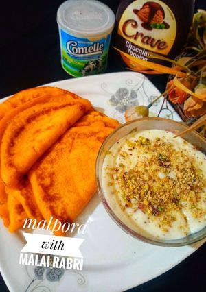 A picture of Malpora with Malai rabri.