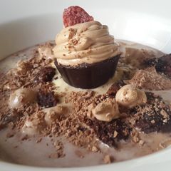 A picture of Chocolate soup with brownie croutons and mousse dessert.