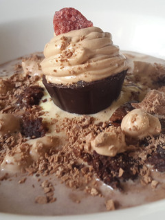 A picture of Chocolate soup with brownie croutons and mousse dessert.