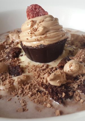 A picture of Chocolate soup with brownie croutons and mousse dessert.