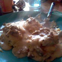 A picture of Biscuits All Covered In Gravy.