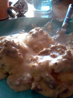 A picture of Biscuits All Covered In Gravy.