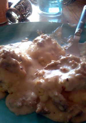 A picture of Biscuits All Covered In Gravy.