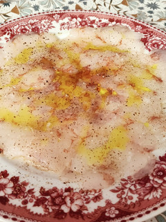 Una foto de Carpaccio de gambón salvaje