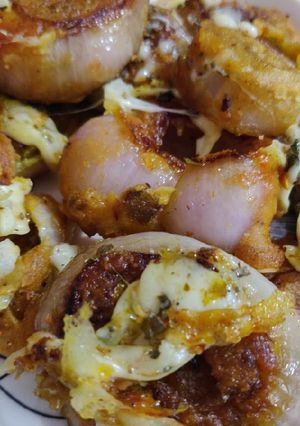 A picture of Stuffed Onion Rings loaded with cheese.