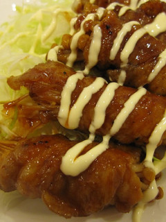 A picture of Thinly Sliced Pork and Enoki Mushroom in Gochujang Sauce.