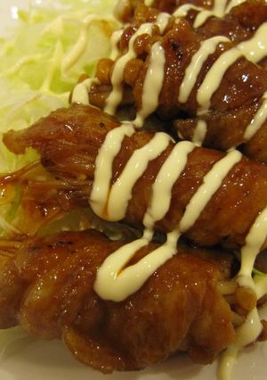 A picture of Thinly Sliced Pork and Enoki Mushroom in Gochujang Sauce.