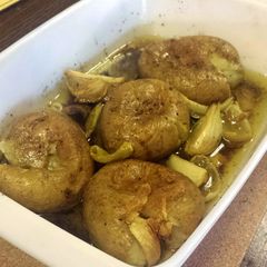 A picture of Squashed Potatoes in Olive Oil.