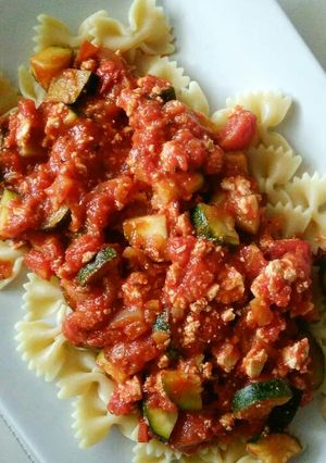 A picture of Tomato sauce with tofu and zucchini.