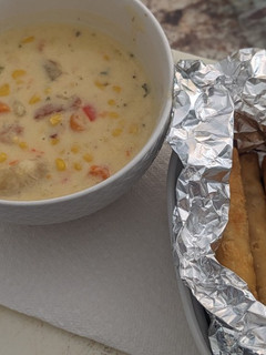 A picture of Easy Shawarma Corn Chowder in Insta pot Duo 6 qt with side of frozen fried taquitos.