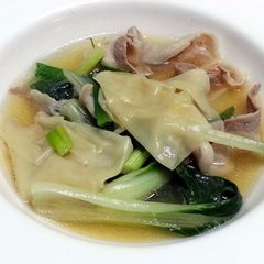 A picture of Bak Choy And Dumpling In Pork Broth.