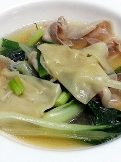 A picture of Bak Choy And Dumpling In Pork Broth.